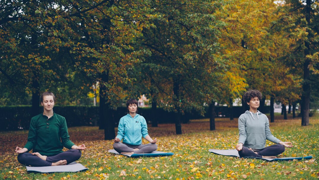person meditating outdoors