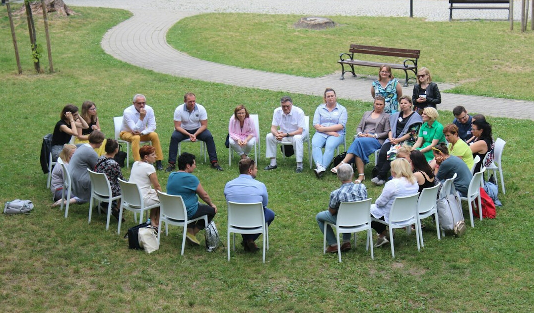 group of people discussing in circle