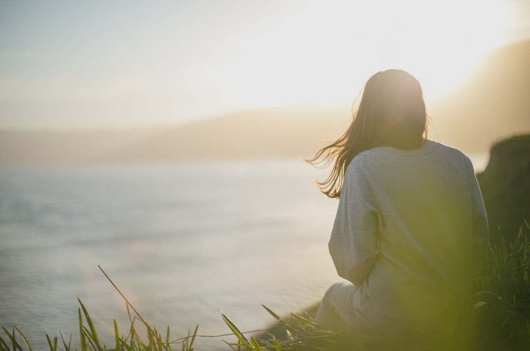 person thinking deeply alone