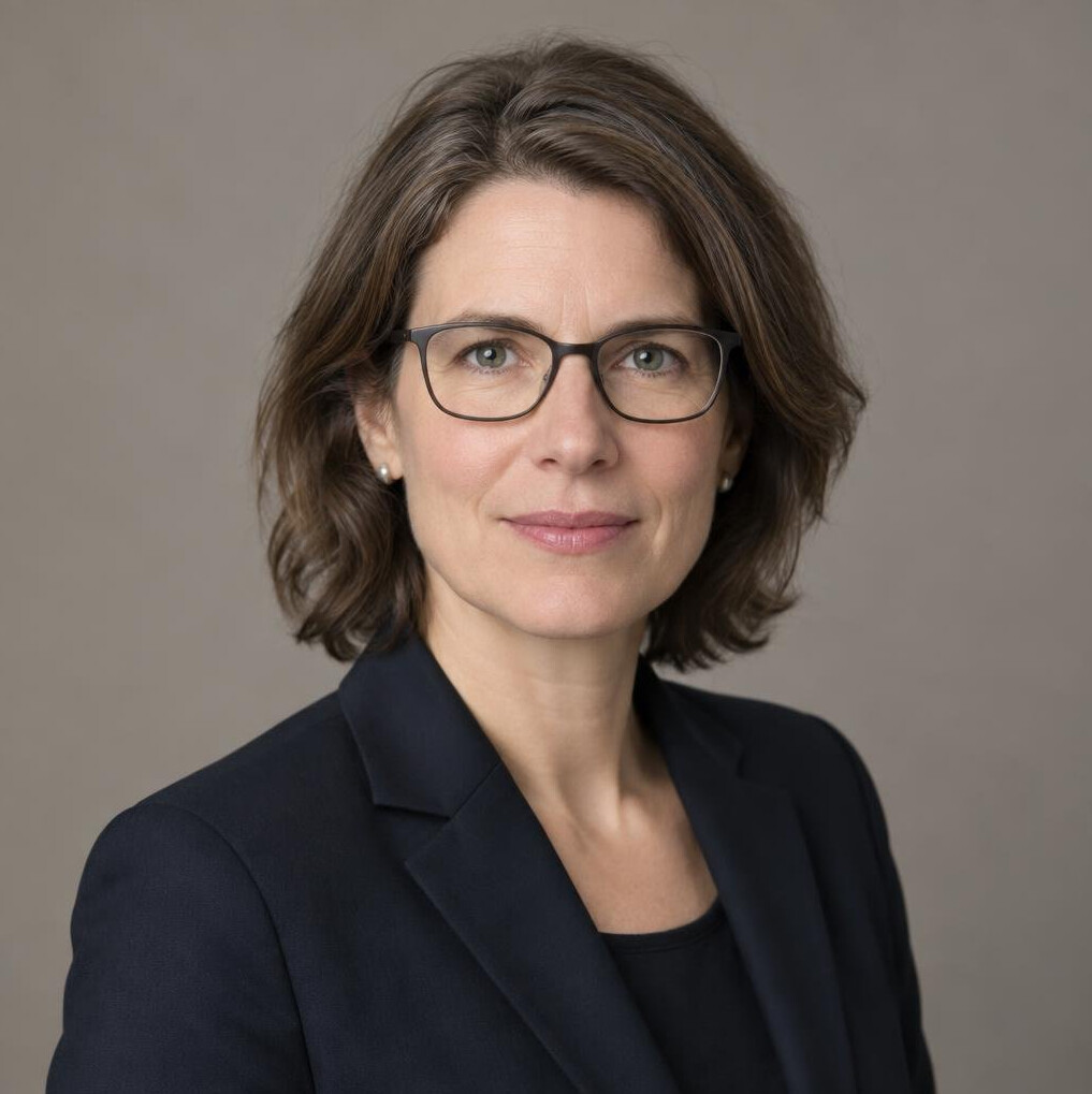 Studio portrait of a middle-aged European woman researcher with glasses, calm expression